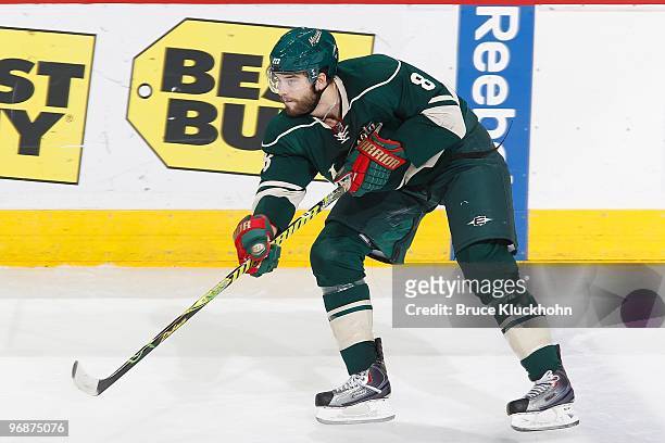 Brent Burns of the Minnesota Wild delivers a pass against the Vancouver Canucks during the game at the Xcel Energy Center on February 14, 2010 in...