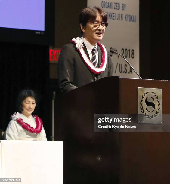 Japanese Prince Akishino delivers a speech at the opening ceremony of the 59th Convention of Nikkei and Japanese Abroad in Honolulu on June 6, 2018....