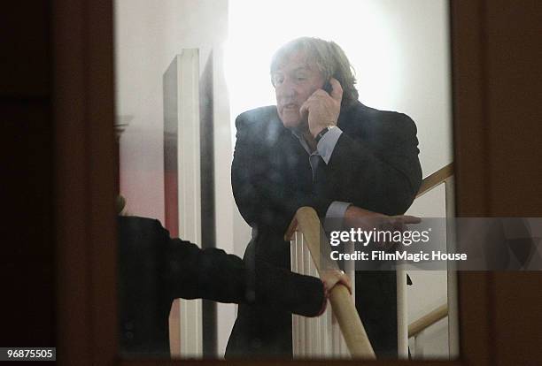 Actor Gerard Depardieu speaks on his phone after he attended the 'Mammuth' Photocall during day nine of the 60th Berlin International Film Festival...