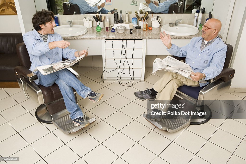 Men sitting in barber shop