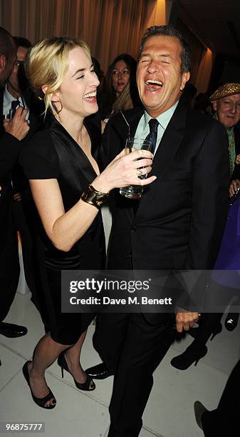 Kate Winslet and Mario Testino attend the Lancome and Harper's Bazaar Pre-BAFTA Party co-hosted by actress Kate Winslet, at St Martin's Lane Hotel on...