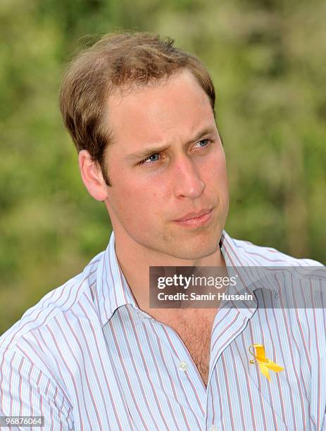 Prince William speaks to members of a family who lost their home to the bushfires of 2009 on the third and final day of his unofficial visit to...