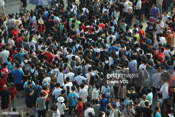 Candidates enter an exam site for the National College Entrance Examination at Zhengzhou Foreign Language School on June 7, 2018 in Zhengzhou, Henan...