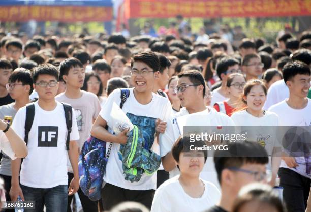 Candidates enter an exam site for the National College Entrance Examination on June 7, 2018 in Bozhou, Anhui Province of China. About 9.75 million...