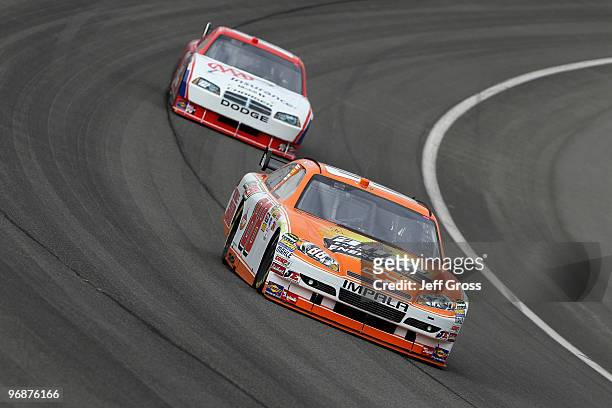 Dale Earnhardt Jr. Drives the Amp Energy Juice Chevrolet during practice for the NASCAR Sprint Cup Series Auto Club 500 at Auto Club Speedway on...