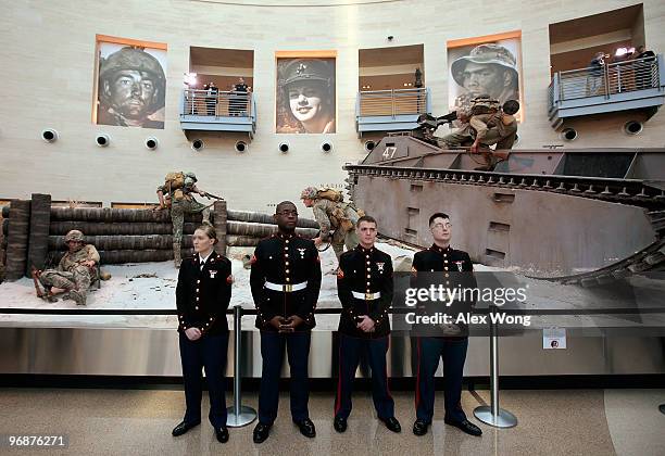 Group of Marines stand next to an exhibit during a ceremony to mark the 65th anniversary of the battle of Iwo Jima February 19, 2010 at the National...
