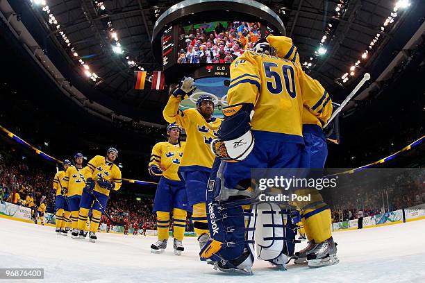 Goalkeeper Jonas Gustavsson of Sweden celebrate after with his team defeating Belarus 4-2 during the ice hockey men's preliminary game on day 8 of...