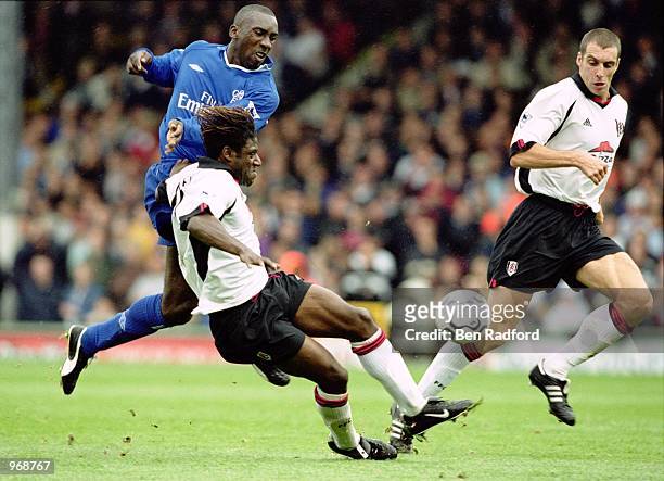 Jimmy Floyd Hasselbaink of Chelsea tries to get his shot past Rufus Brevett and Andy Melville of Fulham during the FA Barclaycard Premiership match...