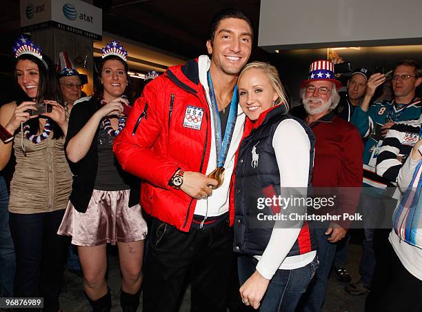 Evan Lysacek of the United States shares his men's figure skating Olympic gold medal with U.S. Gymnast Nastia Liukin at the USA House on February 18,...