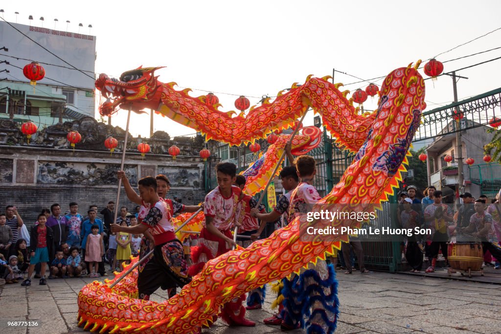 Dragon dancing on the street of Saigon in occasion of Lantern Festival.