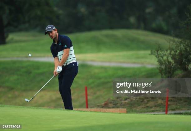 Bradley Neil of Scotland chips onto the 7th green during day one of the 2018 Shot Clock Masters at Diamond Country Club on June 7, 2018 in...