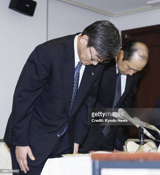 Yuzuru Yamamoto, president of Japanese chemical product maker Ube Industries Ltd., bows in apology during a press conference in Tokyo on June 7 over...