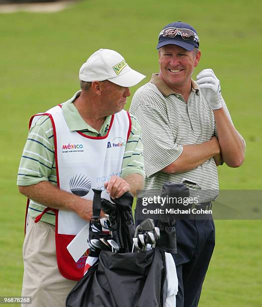 Hayes has a laugh with his caddie during the second round of the Mayakoba Golf Classic at El Camaleon Golf Club held on February 19, 2010 in Riviera...