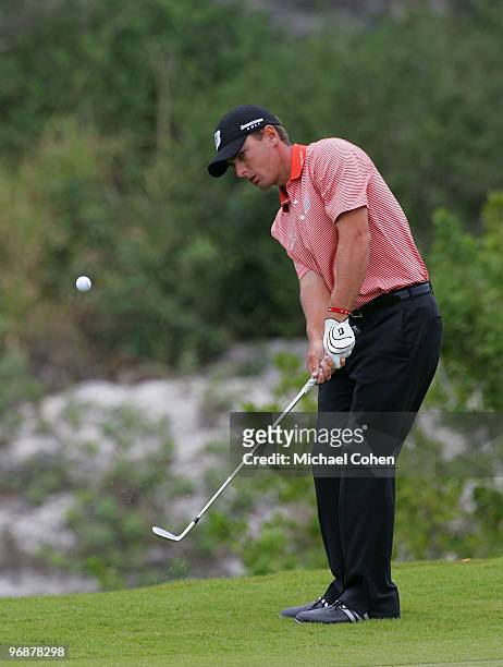 Charles Howell III hits a pitch shot during the second round of the Mayakoba Golf Classic at El Camaleon Golf Club held on February 19, 2010 in...