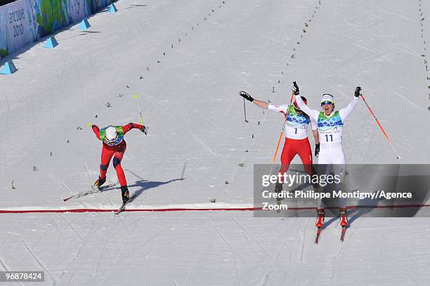 Anna Haag of Sweden takes 2nd place, Justyna Kowalczyk of Poland takes 3rd place, and Kristin Stoermer Steira of Norway during the Ladies' 15 km...