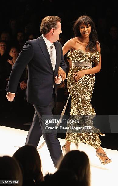 Piers Morgan and Naomi Campbell walk down the catwalk at Naomi Campbell's Fashion For Relief Haiti London 2010 Fashion Show at Somerset House on...