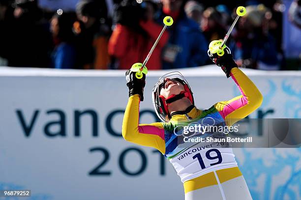 Maria Riesch of Germany celebrates after crossing the line during the Alpine Skiing Ladies Super Combined Slalom on day 7 of the Vancouver 2010...