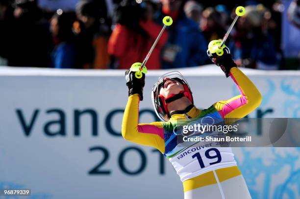 Maria Riesch of Germany celebrates after crossing the line during the Alpine Skiing Ladies Super Combined Slalom on day 7 of the Vancouver 2010...