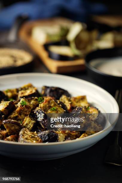 roasted aubergine cubes with sesame seeds - haoliang stock pictures, royalty-free photos & images