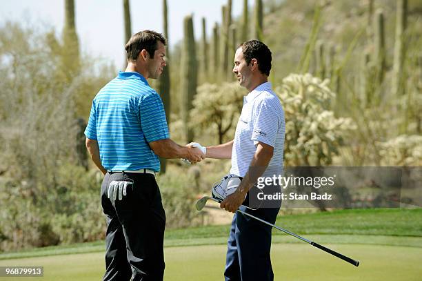 Paul Casey, left, of England defeated Mike Weir, right, of Canada during the second round of the World Golf Championships-Accenture Match Play...