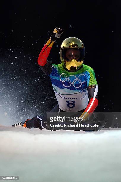 Anja Huber of Germany reacts after she completed her run in the women's skeleton fourth heat on day 8 of the 2010 Vancouver Winter Olympics at the...