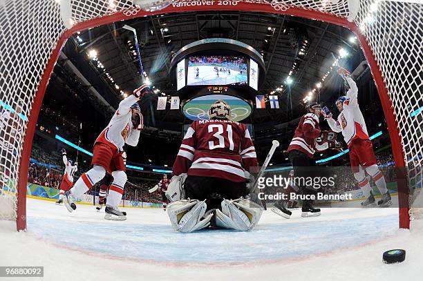 Milan Michalek of Czech Republic celebrates his goal against Edgars Masalskis of Latvia during the ice hockey men's preliminary game between Czech...