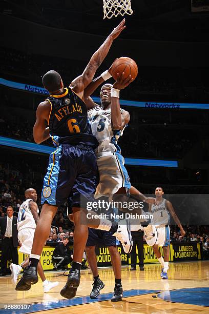 Josh Howard of the Washington Wizards shoots against Arron Afflalo of the Denver Nuggets at the Verizon Center on February 19, 2010 in Washington,...