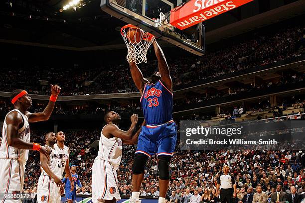 Shaquille O'Neal of the Cleveland Cavaliers blocks against DeSagana Diop of the Charlotte Bobcats on February 19, 2010 at the Time Warner Cable Arena...