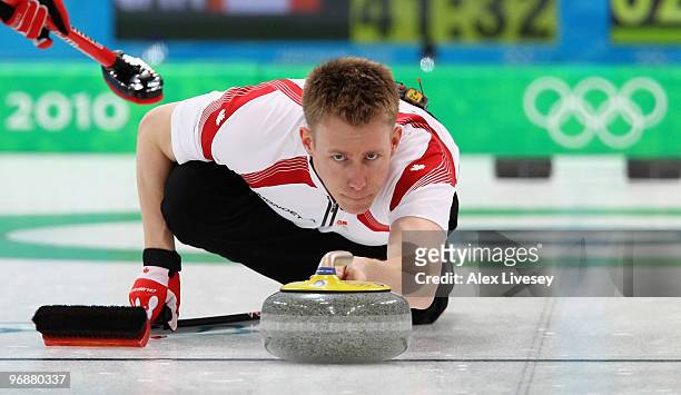 Marc Kennedy of Canada releases a stone during the Men's Curling Round Robin match between Denmark and Canada on day 8 of the Vancouver 2010 Winter...