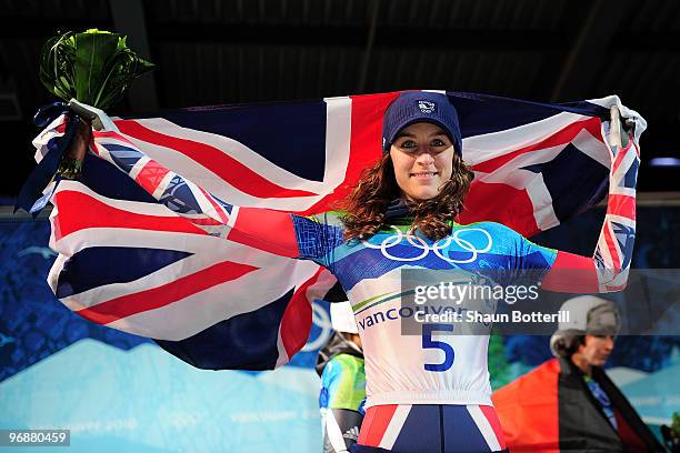 Amy Williams of Great Britain and Northern Ireland celebrates winning the gold medal during the flower cermony for the women's skeleton fourth heat...