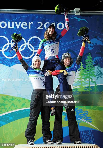 Kerstin Szymkowiak of Germany celebrates winning the silver meda, Amy Williams of Great Britain and Northern Ireland gold and Anja Huber of Germany...