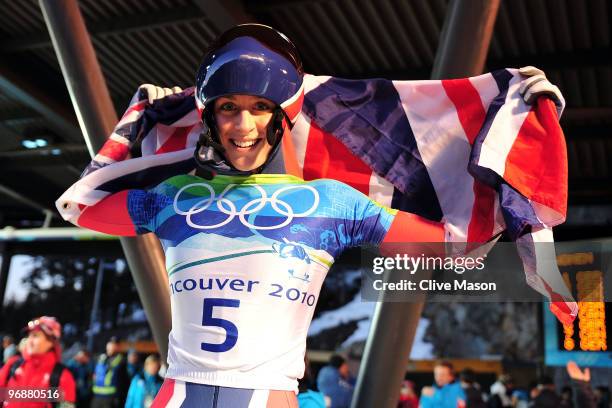 Amy Williams of Great Britain and Northern Ireland celebrates winning the gold medal during the flower cermony for the women's skeleton fourth heat...