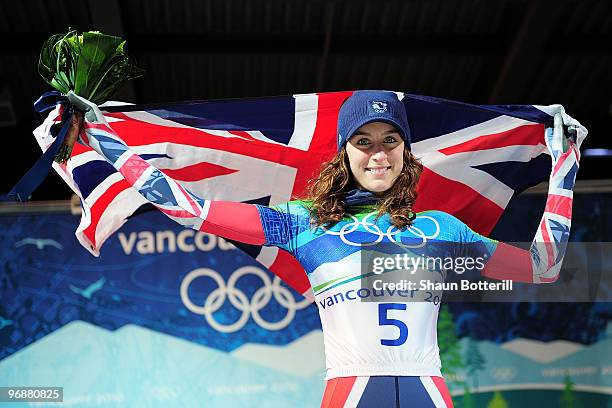 Amy Williams of Great Britain and Northern Ireland celebrates with her countries flag after winning the gold medal during the flower cermony for the...