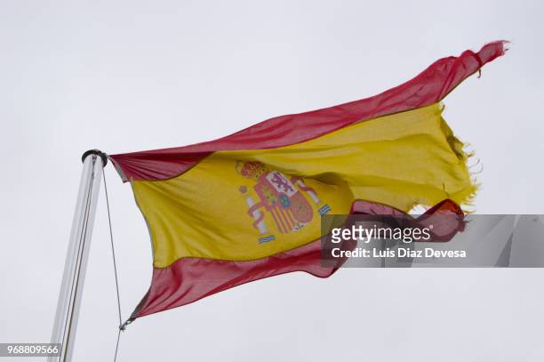 frayed spanish flag - frayed stock pictures, royalty-free photos & images