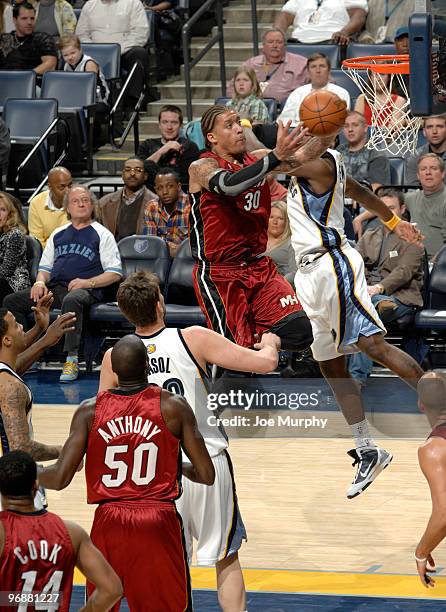 Michael Beasley of the Miami Heat shoots against Ronnie Brewer of the Memphis Grizzlies on February 19, 2010 at FedExForum in Memphis, Tennessee....