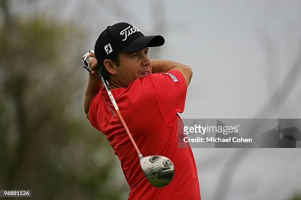 Erik Compton watches his drive during the first round of the Mayakoba Golf Classic at El Camaleon Golf Club held on February 18, 2010 in Riviera...