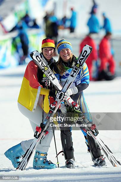 Maria Riesch of Germany and Anja Paerson of Sweden celebrate after the Alpine Skiing Ladies Super Combined Slalom on day 7 of the Vancouver 2010...