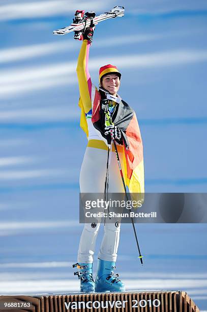 Maria Riesch of Germany celebrates gold during the flower ceremony for the women's super combined alpine skiing on day 7 of the Vancouver 2010 Winter...
