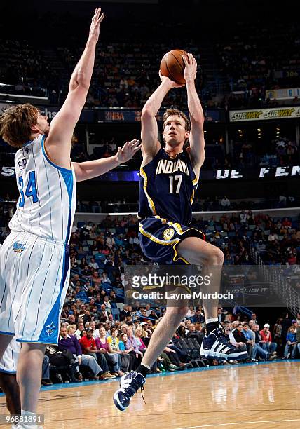 Mike Dunleavy of the Indiana Pacers shoots against Aaron Gray of the New Orleans Hornets on February 19, 2010 at the New Orleans Arena in New...