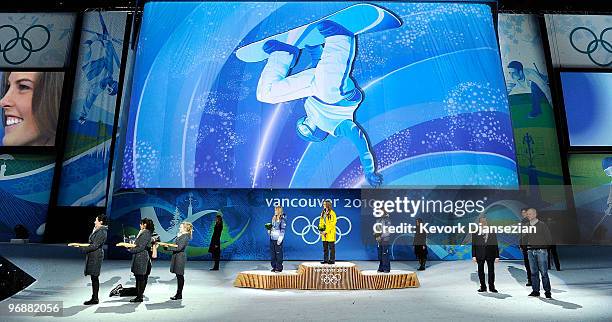 Hannah Teter of United States celebrates winning Silver, Torah Bright of Australia Gold, and Kelly Clark of United States Bronze during the medal...