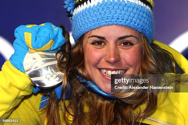 Anna Haag of Sweden celebrates winning silver during the medal ceremony for the women's biathalon 15 km pursuit on day 8 of the Vancouver 2010 Winter...