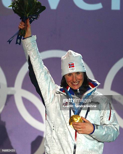 Marit Bjoergen of Norway celebrates gold during the medal ceremony for the women's biathalon 15 km pursuit on day 8 of the Vancouver 2010 Winter...