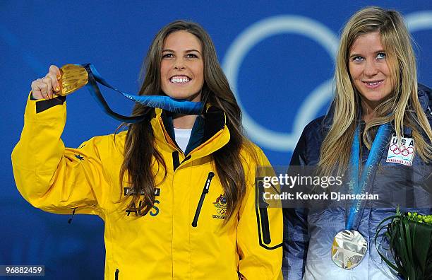 Torah Bright of Australia celebrates receiving the gold medal and Hannah Teter of United States silver during the medal ceremony for the women's...