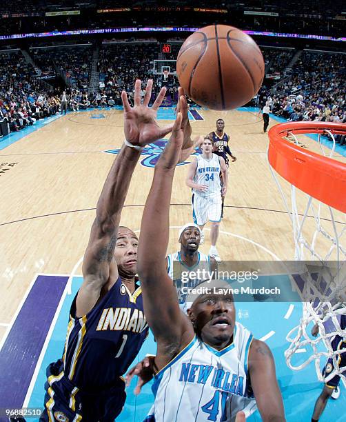 James Posey of the New Orleans Hornets shoots on Dahntay Jones of the Indiana Pacers on February 19, 2010 at the New Orleans Arena in New Orleans,...