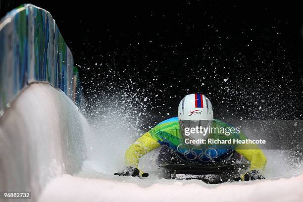 Kazuhiro Koshi of Japan competes in the men's skeleton fourth heat on day 8 of the 2010 Vancouver Winter Olympics at the Whistler Sliding Centre on...