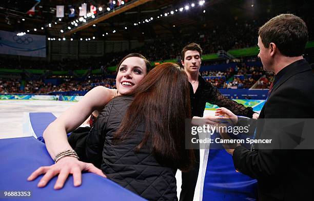 Tessa Virtue and Scott Moir of Canada leave the ice after their performance in the Figure Skating Compulsory Ice Dance on day 8 of the Vancouver 2010...