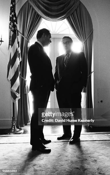 Secretary of State Henry Kissinger and White House Chief of Staff Alexander Haig talk in the Cabinet Room at the White House six days after Gerald R....