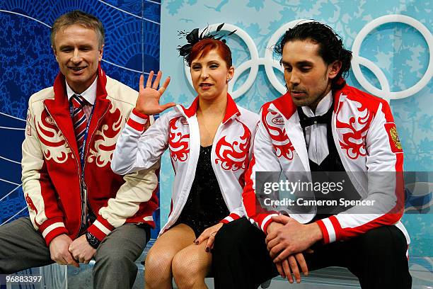 Jana Khokhlova and Sergei Novitski of Russia look on in the kiss and cry area in the Figure Skating Compulsory Ice Dance on day 8 of the Vancouver...