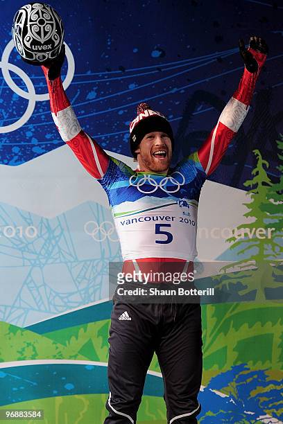 Jon Montgomery of Canada celebrates the gold medal during the flower ceremony for the men's skeleton on day 8 of the 2010 Vancouver Winter Olympics...