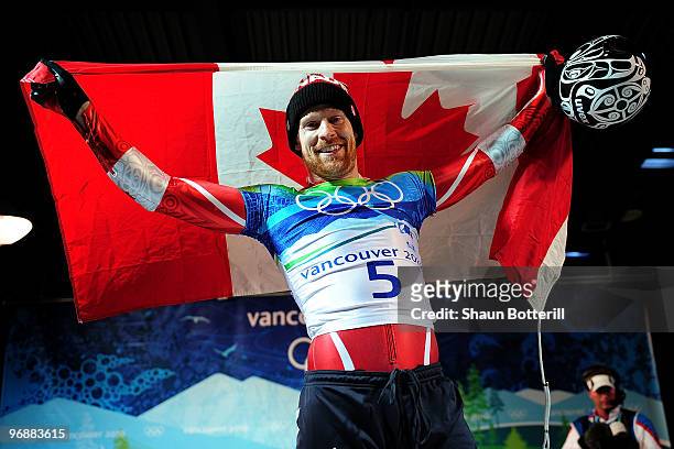Jon Montgomery of Canada celebrates winning the gold medal during the flower ceremony for the men's skeleton on day 8 of the 2010 Vancouver Winter...